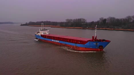 Aerial-Port-Side-View-Of-Wilson-Leith-Cargo-Ship-On-Oude-Maas