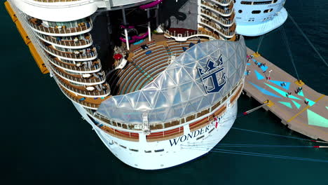 Rising-drone-shot-of-the-aft-of-the-Wonder-Of-The-Seas-Royal-Caribbean-cruise-ship-at-dock