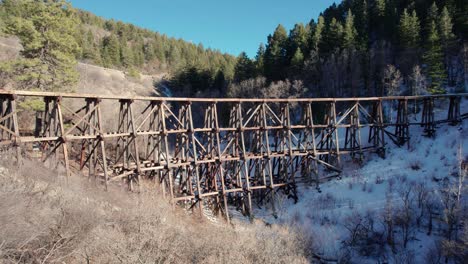 Drone-view-of-an-old-wooden-bridge-with-railroad-tracks