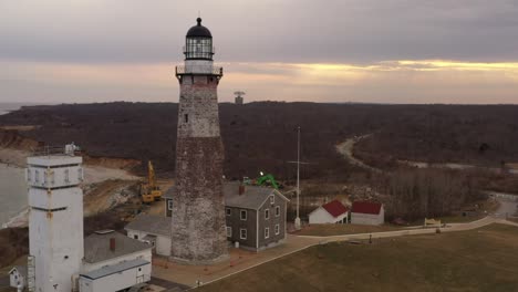 An-aerial-view-of-the-Montauk-lighthouse-during-a-cloudy-sunset