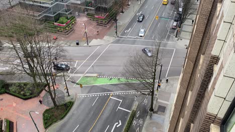 Aerial-view-of-sidewalk-and-intersection-traffic-road-with-car-and-pedestrian-in-Vancouver-Canada-British-Columbia