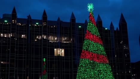 Colorful-Christmas-tree-with-PPG-building-in-the-background-in-downtown-Pittsburgh,-Pennsylvania