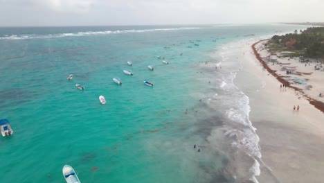 Aerial-drone-shot-over-lots-of-boats-in-the-ocean