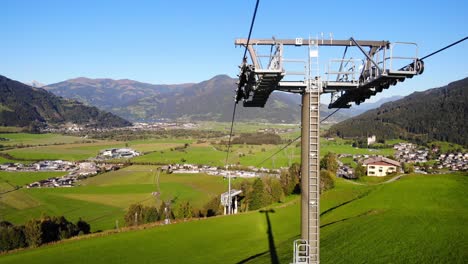 Maiskogelbahn-Gondola-Tower-At-Hilltop-Overlooking-The-Town-Of-Kaprun-In-Salzburg,-Austria