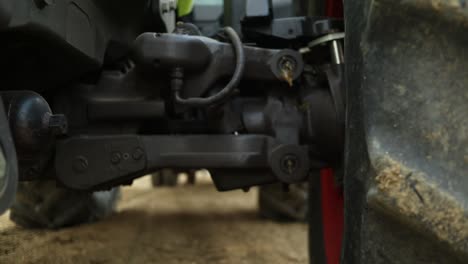 close-up-shot-under-the-big-agricultural-tractor,-big-machines-for-organic-farming