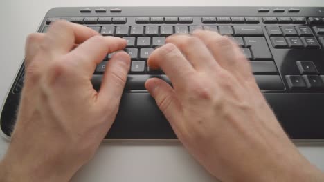 Man-typing-on-a-keyboard
