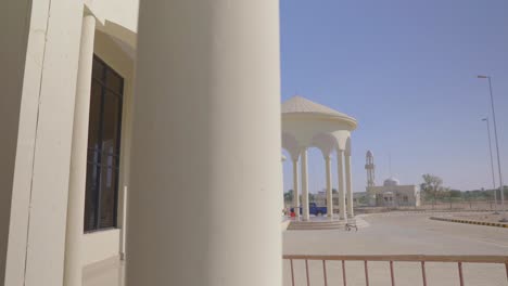 Outside-Dolly-Right-View-Across-Pillars-Of-Mai-Bakhtawar-Airport-On-Clear-Sunny-Day