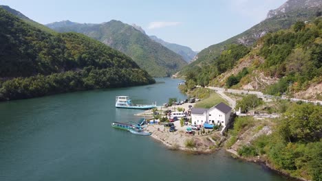 Lake-Koman-Ferry-Terminal-at-Fierze,-Albania---Aerial-View-during-Summer