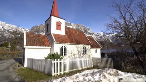 Moving-towards-side-of-famous-miniature-stave-church-of-Undredal-Norway-during-sunny-day