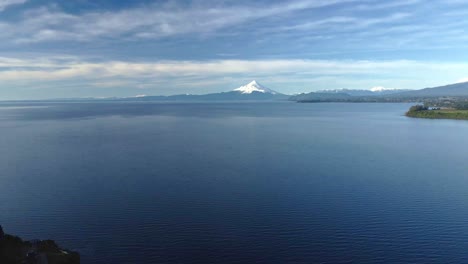 Dolly-out-aerial-view-of-Lake-Llanquihue-with-Osorno-volcano-in-the-background,-Puerto-Varas,-Chile