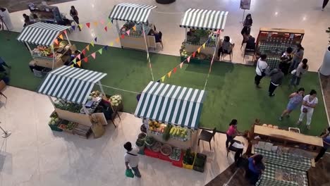 Exhibitors-attend-to-prospective-customers-surveying-their-displays-at-a-recent-Locally-Sourced-trade-show-at-Robinsons-Galleria-in-Cebu-City,-featuring-farm-produce-and-related-businesses