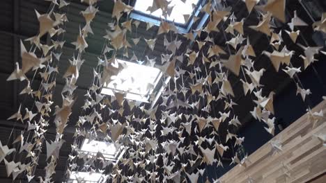 White-paper-cranes-hanging-from-the-ceiling