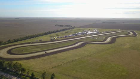 Aerial-View-Of-Car-Track-On-Which-Racing-Cars-Drive---Race-Track-On-A-Practice-Day---drone-shot