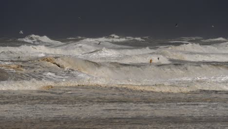 Storm-at-sea,-winds,-big-waves-crash-at-Scheveningen,-Den-Haag,-The-Netherlands