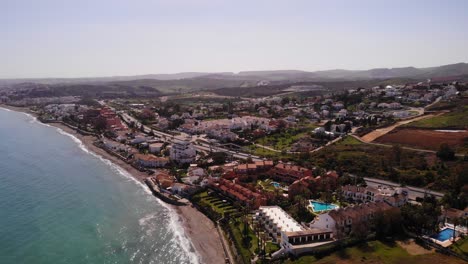 Aerial-View-Of-Estepona-Coastline-With-Beach-Front-Properties-Along-The-Costa-Del-Sol