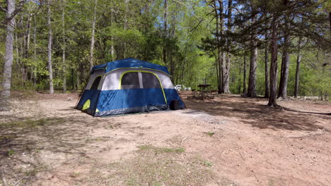 Camp-ground-with-tent-in-a-forest