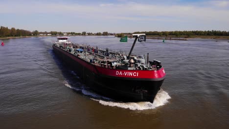 Aerial-Tracking-Shot-Off-Forward-Bow-Of-Da-Vinci-Motor-Tanker-Ship-Along-Oude-Maas