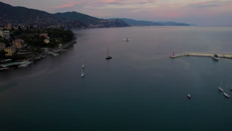 Yachts-at-Sunset-in-the-Exotic-Lagoon-of-Portofino,-Italy---Aerial