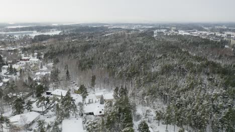 Aerial-forward-moving-view-of-residential-area-"Pitkämäki"-in-winter-time-after-snowfall-when-everything-is-covered-in-snow