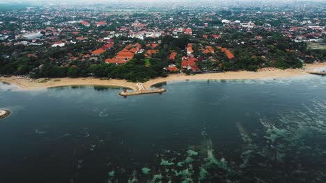 Beautiful-cinematic-Sanur-beach,-Bali-drone-footage-with-interesting-landscape,-fishing-boats,-resorts,-hotels-and-calm-weather