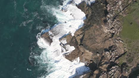 Best-aerial-top-down-foamy-wave-crashing-the-rocks