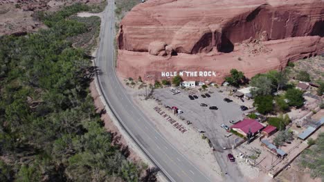 Touristic-Hole-in-the-Rock-Roadside-Attraction-in-Southwest-US-Desert---Aerial