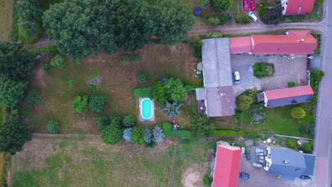 country-living,-pool,-garden
Stunning-aerial-view-flight-bird's-eye-view-drone-footage-at-Countryside-village-Hainichen-in-Europe-Saxony-Anhalt,-summer-2022