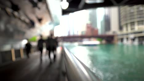 Out-of-focus-view-of-people-walking-in-Chicago-Riverwalk