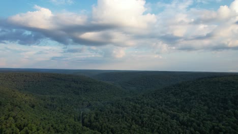 An-aerial-view-of-green-hills-with-cloudy-sky-in-the-Allegheny-National-Forest