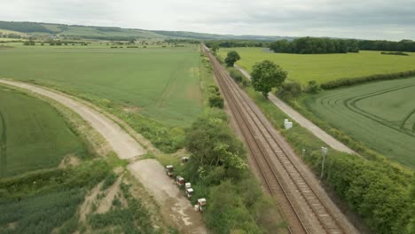 aerial-view-of-rail-way-track-in-rural-UK-countryside-drone-fly-over