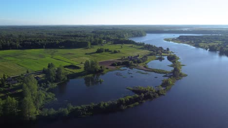 AERIAL-Panning-Shot-of-a-Meandering-River-and-Swampland-in-Rural-Lithuania