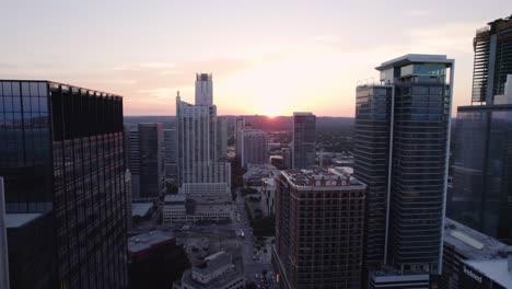 Aerial-view-over-downtown-buildings,-colorful-sunset-in-Austin,-Texaa,-USA