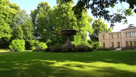 Porphyry-Vase-in-Summer,-a-Beautiful-Sculpture-in-the-Middle-of-Rosendals-Park-in-Stockholm,-Sweden