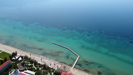 Aerial-View-Of-A-Pier-With-Crystalline-Ocean-Near-Kusadasi-Resort-On-Aegean-Coast-In-Turkey