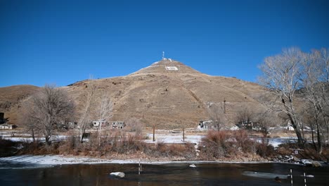Viewing-Salida's-Tenderfoot-S-mountain-from-the-Arkansas-River-during-the-day,-handheld