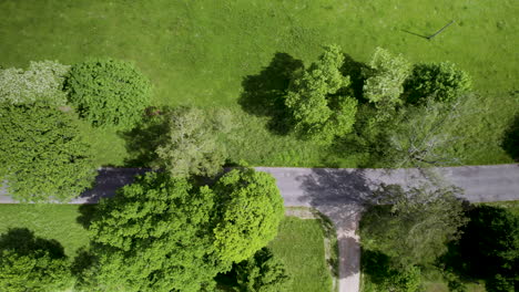 Empty-Intersection-of-Asphalt-and-Dirt-Road,-Drone-Top-Down-View