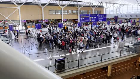 People-lining-up-at-the-airport-as-they-just-landed-and-must-go-through-immigration