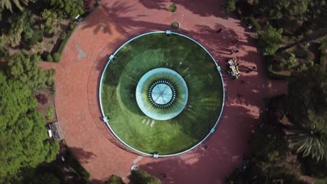 Top-down-spinning-view-of-a-fountain-in-a-park-in-Mexico-City