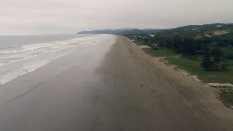 A-Stretch-Of-Long-Sandy-Beach-On-A-Cloudy-Day-In-La-Curia,-Santa-Elena-Province,-Ecuador---aerial-drone-shot
