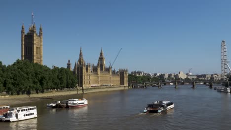 Uber-River-Boat-Going-Past-Houses-Of-Parliament-On-14-June-2022-Viewed-From-Lambeth-Bridge