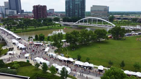 Columbus-Arts-Festival,-Columbus-Ohio,-aerial-drone-footage,-over-the-Scioto-River-on-the-Rich-Street-and-Town-Street-bridges-in-downtown-Columbus,-Ohio-2022