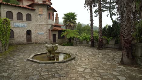 Villa-Sassetti-and-Fountain-on-Mountain-with-Fog-And-Mist-Clouding-Above
