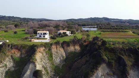 Breathtaking-aerial-view-flight-panorama-overview-drone-footage-of-a
luxury-villa-at-paradise-wild-nature-canyon-dream-Beach-Marathias-Malibu-Corfu-Greece