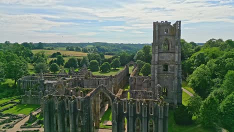 Drone-aerial-footage-of-the-historical-13th-century-Fountains-Abby-ruins-in-North-Yorkshire---England-UK