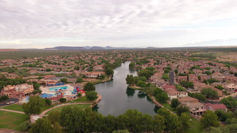 Drone-view-of-Rancho-Sahuarita-and-Sahuarita-Lake,-a-new-home-community-in-Southern-Arizona
