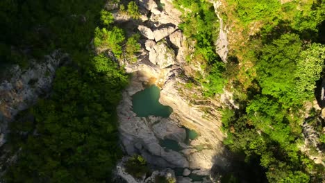 headshot-drone-downward-motion-of-Albanian-canyon-"Syri-i-ciklopit