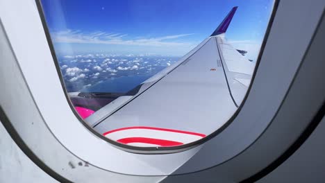 Wizzair-jet-airplane-flying-over-Latium-coast-in-Italy