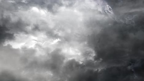 4k-thunderstorm-inside-a-thick-gray-cumulus-cloud-and-dark-sky