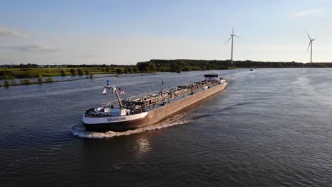 Aerial-View-Of-Approaching-Brandini-Inland-Tanker-Travelling-Along-Oude-Maas-During-Evening-Sun-Light