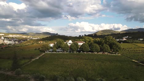 Aerial-view-of-Quinta-da-Pacheca-the-luxurious-Wine-House-Hotel-in-Lamego,-in-the-heart-of-the-Douro-region,-is-surrounded-by-extensive-private-grounds-with-vineyards